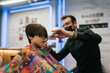 © Mal de Ojo Studio/Stocksy - Barber Confidently Cuts Child's Hair