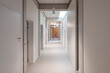 © Koen Van Damme/Stocksy - empty hallway