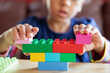 © Anya Brewley Schultheiss/Stocksy - Closeup of blocks being assembled by a child