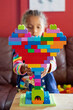 © Anya Brewley Schultheiss/Stocksy - Child building a heart shaped structure with vibrant blocks