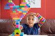 © Anya Brewley Schultheiss/Stocksy - Child building a heart shaped structure with vibrant blocks