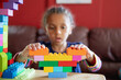 © Anya Brewley Schultheiss/Stocksy - Closeup of blocks being assembled by a child