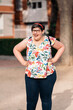 © Santi Nuñez/Stocksy - Joyful portrait of a mentally challenged woman laughing outdoors.