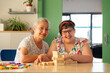 © Santi Nuñez/Stocksy - Therapist aids cognitive development, inspiring positivity.
