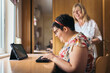 © Santi Nuñez/Stocksy - Handicapped woman using laptop
