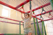 © Alvaro Lavin/Stocksy - Child playing in indoor playground.