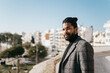 © Mal de Ojo Studio/Stocksy - Man in Coat Portrait