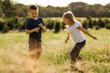 © Image Supply Co/Stocksy - A young boy and girl playing outdoors.