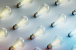 © Giada Canu/Stocksy - pattern of many bright light bulb