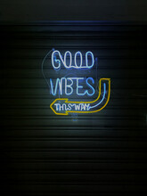 Good vibes this way neon sign