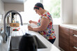 © Santi Nuñez/Stocksy - Handicapped woman having breakfast