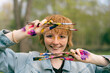 © Léa Jones/Stocksy - fun portrait of happy artist holding paint brushes