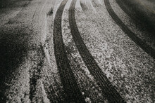 Tire Tracks In Snowy Road