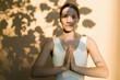 © Artem Podrez/Stocksy - Sunny Yoga: Woman Enjoying Peaceful Morning Practice Outdoors