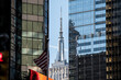 © David Prado/Stocksy - city street with high rise buildings and empire state