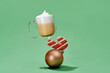 © Marc Tran/Stocksy - cup of tea latter with christmas balls