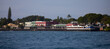 A humpback whale in the view of Front Street in the historic town of Lahaina taken from the harbor, Maui, Hawaii