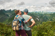 Family Couple traveling together on North Vietnam enjoying view of valley with mountains. Travel to Asia, happiness emotion, summer holiday concept.
