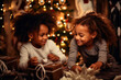 © the_lightwriter - black kids celebrate Christmas with gifts