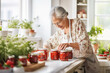 © Kalim - AI generated image of mature senior making preserves