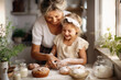 © Kalim - AI generated image of grandma with granddaughter baking