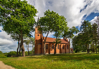 Wall Mural - General view and close-up architectural details of the Catholic Church of St. Holy Trinity in the town of Dwawrzuty in Masuria in Poland.