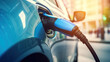© Vittaya_25 - electric vehicle charging station with power cable supply plugged station, EV charging station, green energy, blue power, eco power, electric energy, technology and EV Car concept. Generative AI