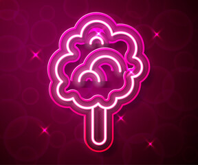 Poster - Glowing neon line Cotton candy icon isolated on red background. Vector