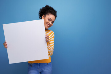 Afro brunette 20s latin young woman demonstrating paper board