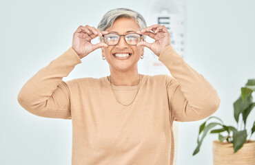 Poster - Mature woman, portrait and glasses for vision eye, test and optometry in clinic wellness, choice and prescription frames. Person, smile and Mexican patient in store, shop and eyesight retail decision