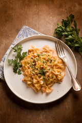 Wall Mural - butterfly pasta with smoked salmon cream sauce and parsley