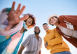 © Wesley/peopleimages.com - Portrait, smile and a group of friends on a blue sky outdoor together for freedom, bonding or fun from below. Diversity, travel or summer with happy men and women laughing outside on vacation