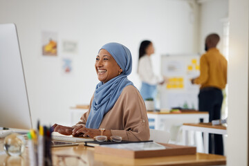 Poster - Smile, email and a Muslim woman in an office with a computer for communication or connection. Happy, business and an Islamic employee in a workspace with a pc for internet, typing or website