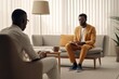Male African-American professional psychologist wearing orange suit having a session with client at mental health clinic.