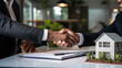 © Fukume - successful real estate transaction, realtor and buyer shaking hands generative ai