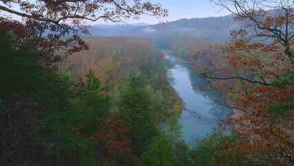 Wall Mural - Drone arial view of autumn river in the ozark mountains of Arkansas with fall colored forest during early morning  