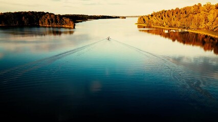 Wall Mural - landscape aerial scene of a sunrise sky over a river with forest trees, for wallpaper