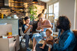 © Marko Geber - Young caucasian family having fast food and burgers after moving in their new home apartment