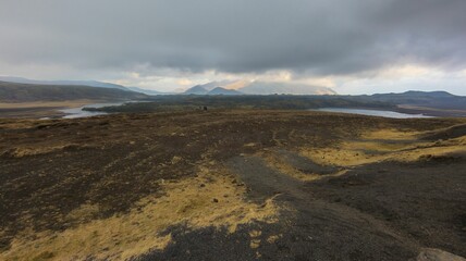 Wall Mural - closeup of a beautiful landscape featuring hills and mountains of iceland during a cloudy weather