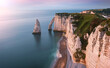 Étretat coastline located in Normandy in Northwestern France during sunset