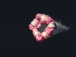 Canvas Print - Macro of a pink flower bud on a dark background