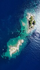 Sticker - Aerial view of a rocky island with several boats floating in the vicinity in Petrovac, Montenegro