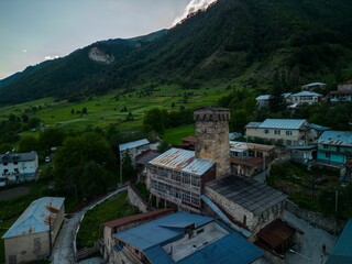 Sticker - Aerial view of an old stone Mestia tower in a picturesque mountain village