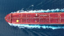 Top-down View Of A Crude Oil Tanker Speeding Through Calm Waters With Trails Of Foam Around Her. Powerful Diesel Engine Of The Oil Tanker Roars At Full Speed And Leaves Wake Water On The Ocean
