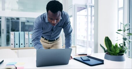 Poster - Busy, typing and a black man with a laptop at work for communication, email or networking. Serious, standing and an African employee typing on a computer in an office for contact, search or the web