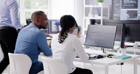 Wall Mural - African Business Team Working On Computer