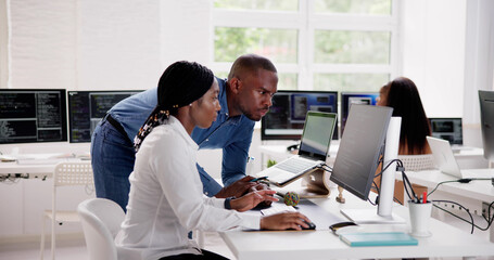 African Business Team Working On Computer