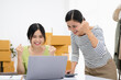 © Fahng - Young asian women happy after new order from customer. Surprise and shock face of asian couple success on making big sale of her online store. Online Selling. Online Shopping