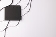 © vectorfusionart - Square of black paper with copy space on white waves of paper on white background