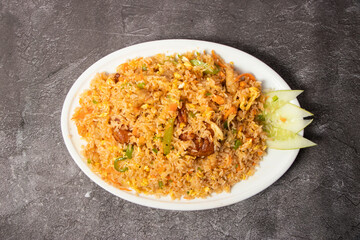 Special Fried Rice with chicken, prawn, egg and vegetable served in dish isolated on background top view of bangladesh food